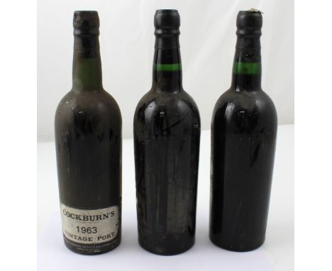 Two bottles of Croft vintage port 1963, and a bottle of Cockburns 1963 vintage port (3). CONDITION REPORT Please note that th