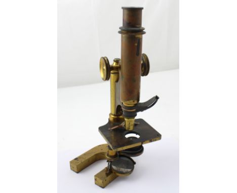 A mahogany cased R &amp; J Peck London microscope. CONDITION REPORT Please note that this lot is not suitable for our in-hous