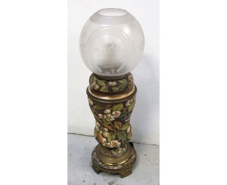 A Victorian brass and stoneware oil lamp, by Hinks &amp; Sons, with floral decoration, the etched shade with continuous hunti