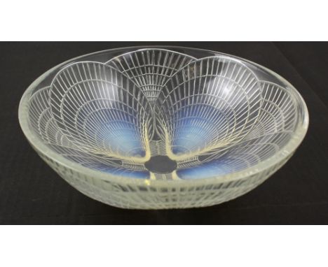 Lalique; a shell decorated glass bowl with 'Lalique France' mark to base, diameter 24cm.