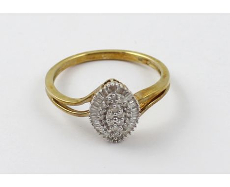 A 9ct gold ladies' dress ring, marquise shape set with small diamonds, size R, approx 2.6g.