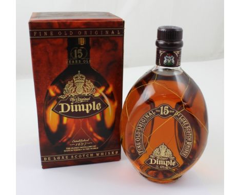 A bottle of Fine Old Original fifteen year old Dimple Delux Scotch Whisky, one litre, in original box. CONDITION REPORT Pleas