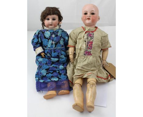 An Armand Marseille 390 size 8 doll and a Heubach and Koppelsdorf 250 ceramic bisque head doll, approx height 51cm (2).