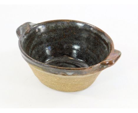 LEACH POTTERY.A Leach Pottery, twin-handled, oval baking dish. Width 20cm. Pottery mark.