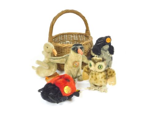 STEIFF.A vintage small wicker basket containing five various Steiff animals including Peggy the Penguin & Crabby the Ladybird