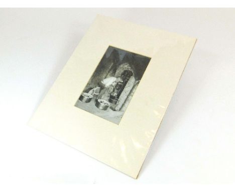 BERNARD LEACH PHOTOGRAPH. A photographic print of Bernard Leach in front of The Leach Pottery kiln. Image 18 x 12cm.