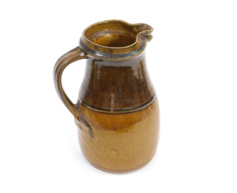 RICHARD BATTERHAM.A quart jug with amber glaze by Richard Batterham. Height 23cm.