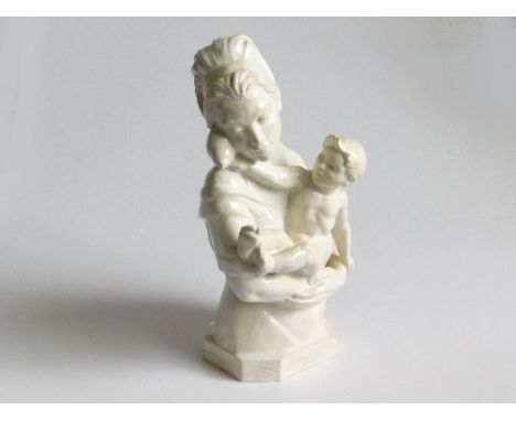 JOYCE BIDDER. A ceramic sculpture by M. Joyce Bidder F.R.S.S., R.M.S. of a mother &amp; child, the child holding a seashell t