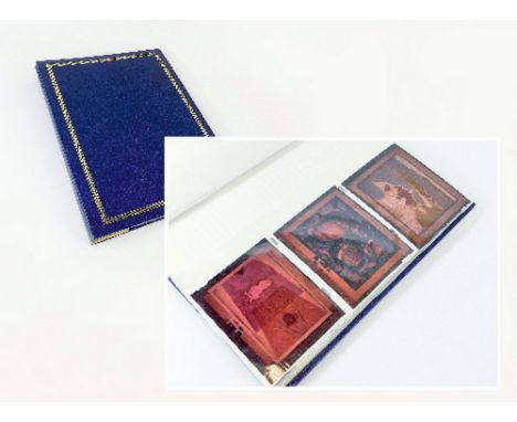 PHOTOGRAPHIC TRANSPARENCIES. A partly-filled album of approx. 27 coloured and 22 black and white transparencies of art works,