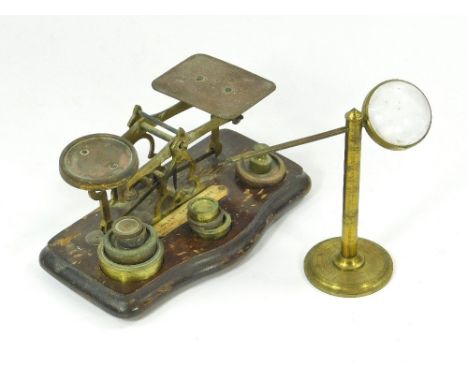 POSTAL SCALE. A Victorian postal scale with various weights. Also a table magnifier.