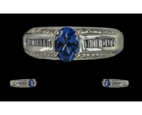 Ladies Contemporary 14ct White Gold Tanzanite and Diamond Set Ring, marked 14ct to interior of shank, the tanzanite of excell