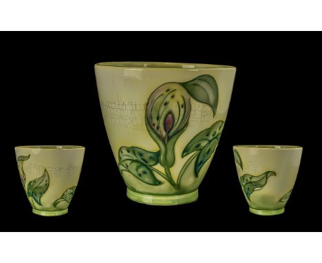 Moorcroft Vintage Ceramic Planter with Arum Lily design on a cream background.  Measures 6.5'' high x 6.5'' diameter.  Hairli