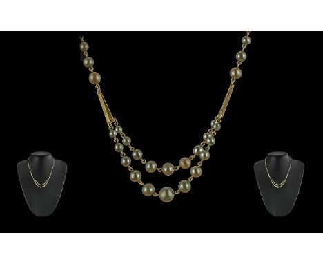 Ladies Vintage and Pleasing 9ct Gold and Pearl Set Necklace of stylish design, marked 9ct, the pearls well matched, length 16