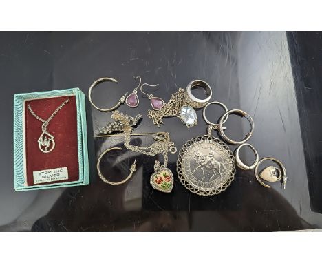 Collection of Silver Items, including a silver locket and chain with enamelled flowers to the front, a silver pendant with a 