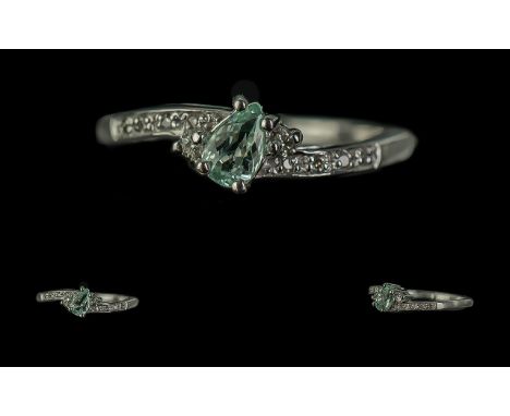 18ct White Gold Ladies Contemporary Dress Ring, twist style with central blue stone and diamond shoulders.  Ring size N.