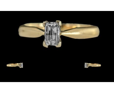 18ct Gold Millennium Single Stone Diamond Set Ring, full hallmark to interior of shank. the step cut diamond is of top colour