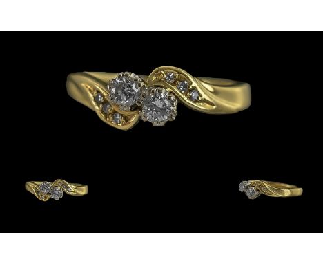 Ladies 18ct Gold Two Stone Diamond Set Ring with diamond set shoulders, full hallmark to interior of shank, the diamonds of g