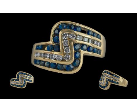 Ladies Contemporary 9ct Gold Diamond &amp; Sapphire Set Dress Ring, full hallmark to interior of shank.  The diamond and sapp