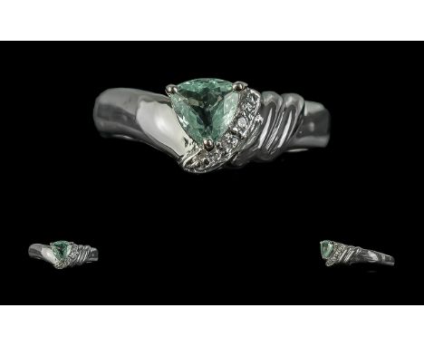 18ct White Gold Ladies Contemporary Dress Ring, central green stone with a diagonal diamond shoulder.  Ring size N.  