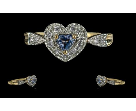 Ladies 9ct Gold Diamond and Tanzanite Set Heart Shaped Ring, full hallmark to shank, the central heart shaped tanzanite of go