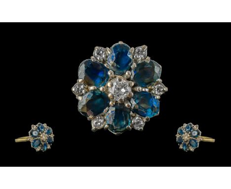 Ladies 9ct Sapphire &amp; Diamond Flowerhead Ring, centre diamond surrounded by six oval sapphires with six small diamonds be