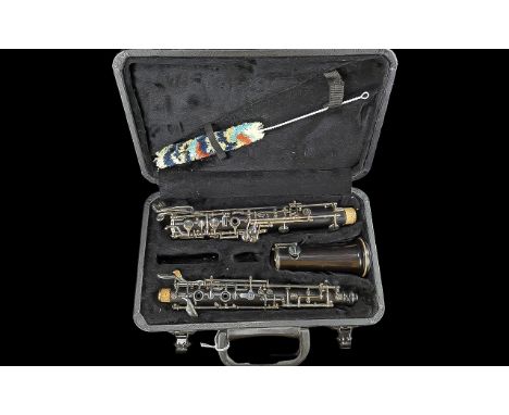 Boxed Clarinet, in black hardshell case.