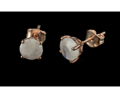 Rainbow Moonstone Pair of Stud Earrings, comprising two round cut solitaires, of approx.1.25cts each, of the mysterious white