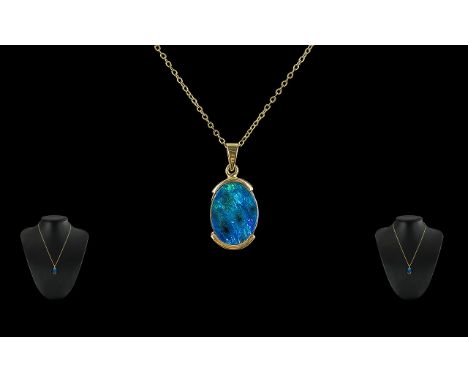 Black Opal Set Pendant Set In A Unmarked 14ct Gold Mount, Attached to a 9ct Gold Long Chain, Marked 9ct. The Large Opal of Ex