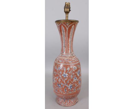 AN ISNIK STYLE CERAMIC VASE, converted to a lamp, decorated with scrolling foliage reserved on an ochre ground, 21in high ove