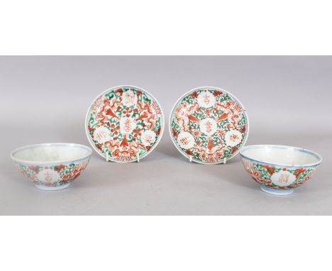 A PAIR OF 19TH CENTURY CHINESE PROVINCIAL IRON-RED &amp; GREEN ENAMELLED PORCELAIN TEABOWLS &amp; SAUCERS, each piece painted