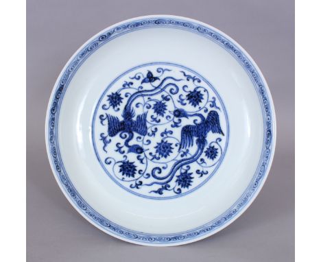 A CHINESE MING STYLE BLUE &amp; WHITE PORCELAIN PHOENIX DISH, the inner rim with a classic scroll border, the base with a six