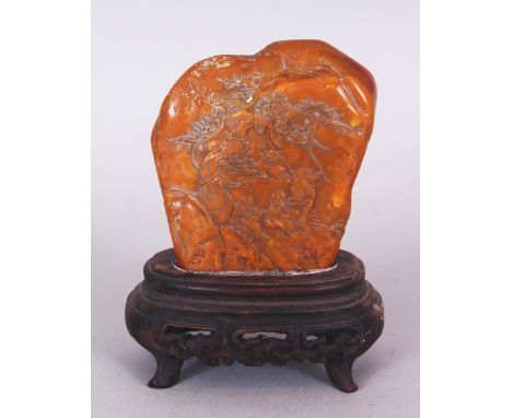 A CHINESE SCHOLAR'S STONE MOUNTAIN BOULDER, together with a fitted wood stand, decorated in low relief with two scenes of sag