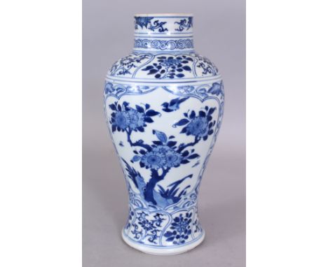 A RARE CHINESE KANGXI PERIOD DUVEEN OF LIVERPOOL BLUE &amp; WHITE PORCELAIN VASE, circa 1700, well painted with shaped foliat