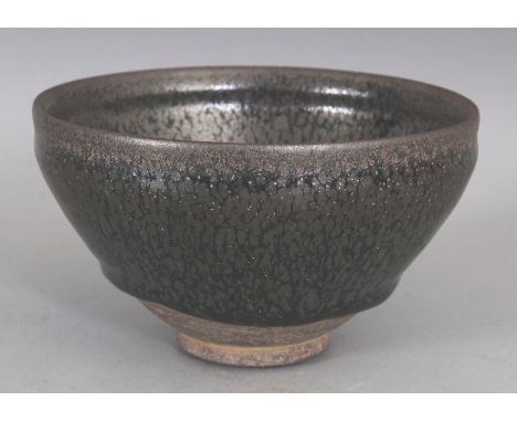 A CHINESE SONG STYLE JUN WARE OIL SPOT CERAMIC TEA BOWL, the glaze falling well short of the foot, 5in diameter &amp; 2.9in h