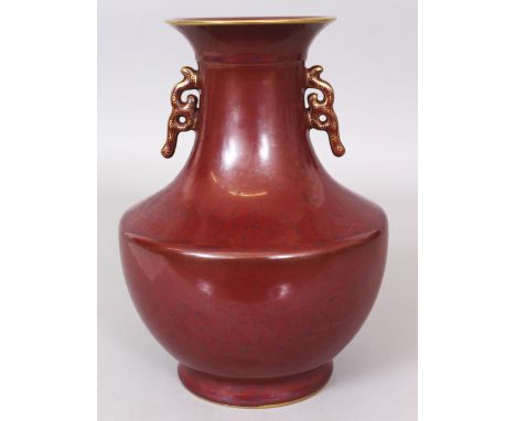 A GOOD QUALITY CHINESE IRON RUST PORCELAIN VASE, the neck moulded with scroll handles, the base with a gilt moulded Qianlong 