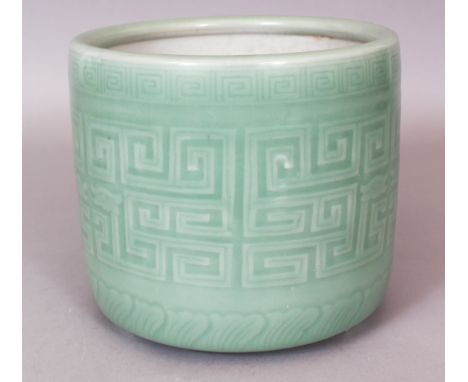 A LARGE CHINESE CELADON GLAZED PORCELAIN TRIPOD CENSER, moulded beneath the glaze with an archaic key-fret design, 7.6in diam