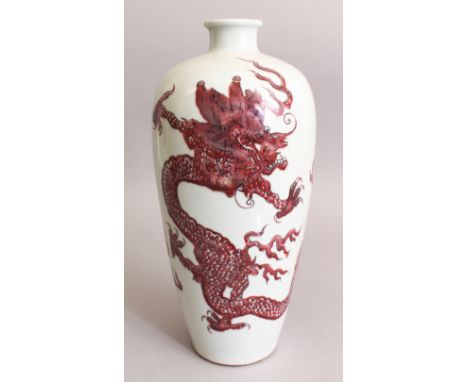 A CHINESE COPPER RED PORCELAIN DRAGON VASE, the base with a six-character Kangxi mark, 13.1in high.