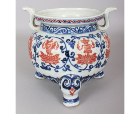 A CHINESE MING STYLE COPPER-RED &amp; UNDERGLAZE-BLUE PORCELAIN TRIPOD, decorated with Buddhist emblems above and within form