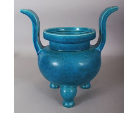 A LARGE GOOD QUALITY CHINESE TURQUOISE GLAZED PORCELAIN TRIPOD CENSER, decorated beneath the glaze with formal scrolling lotu