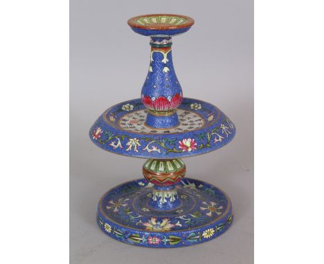 A FINE QUALITY CHINESE BLUE GROUND FAMILLE ROSE PORCELAIN CANDLESTICK, or joss stick holder, the drip pan decorated with call