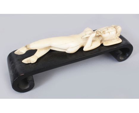 A 19TH/20TH CENTURY CHINESE CARVED IVORY MODEL OF A DOCTOR'S LADY, together with a fitted scroll-footed wood stand, 2.3in hig