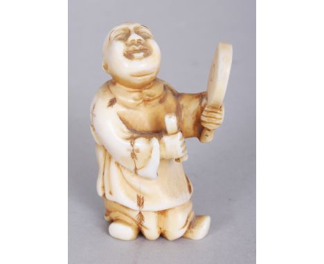 A SIGNED JAPANESE MEIJI PERIOD IVORY NETSUKE OF A STANDING BOY, with uplifted face and holding a mirror, the base with an eng