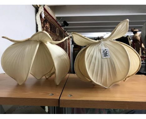 A pair of silk lamp shades.
