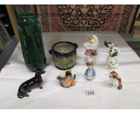 8 ceramic items including Beswick dachsund, Beswick Dalmation, Royal Doulton Highland Snowman, Miniature town crier character