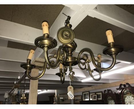 A brass ceiling light.