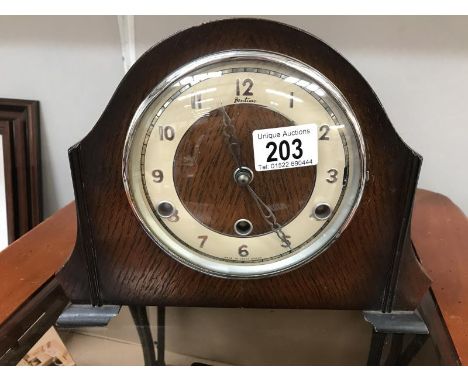 An oak case Bentima mantel clock (no key)