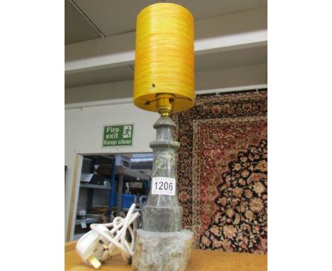 A Cornish serpentine lighthouse table lamp with 1960's orange fibre glass shade.