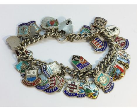 A silver charm bracelet with silver &amp; enamel charms