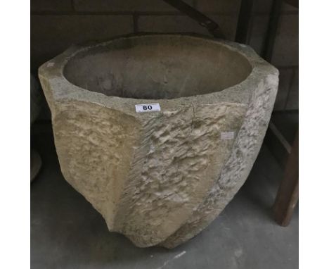 A large stoneware garden planter