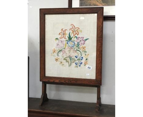 A framed &amp; galzed floral embroidery fire screen